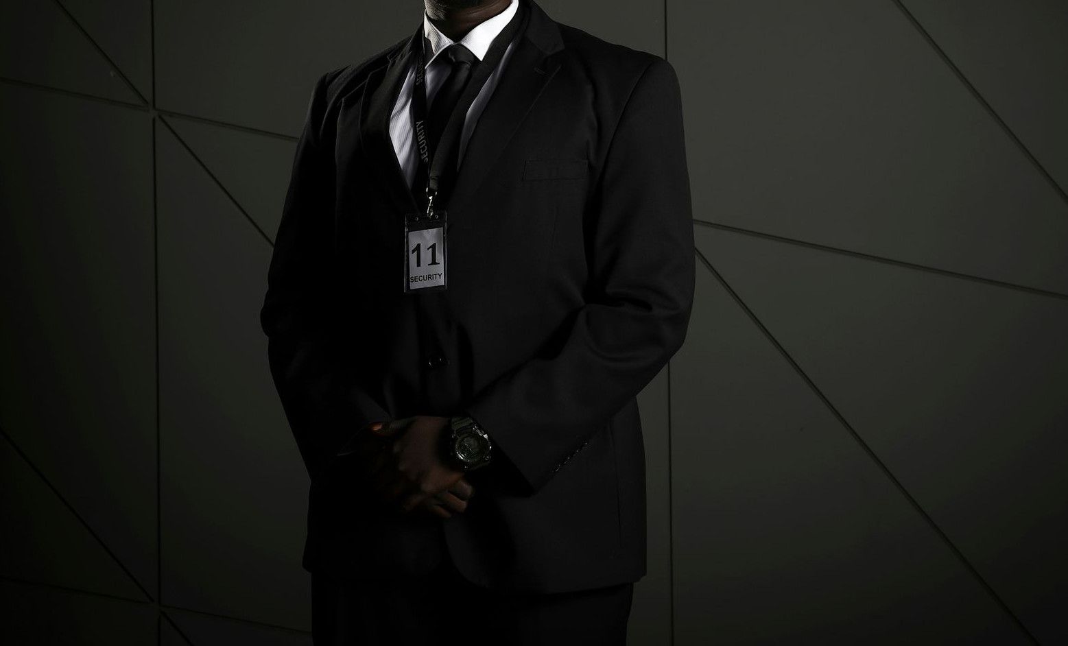 man in black suit wearing black sunglasses